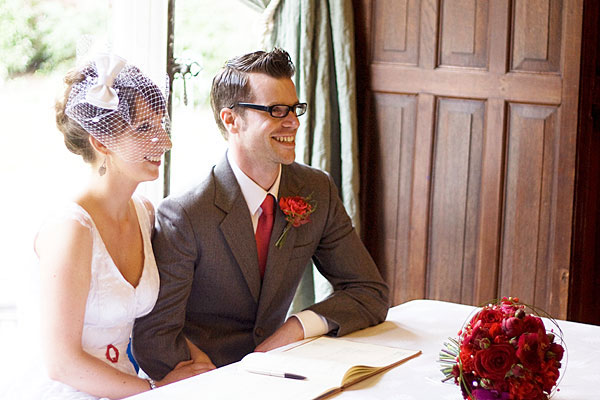 Bride and groom signing the register