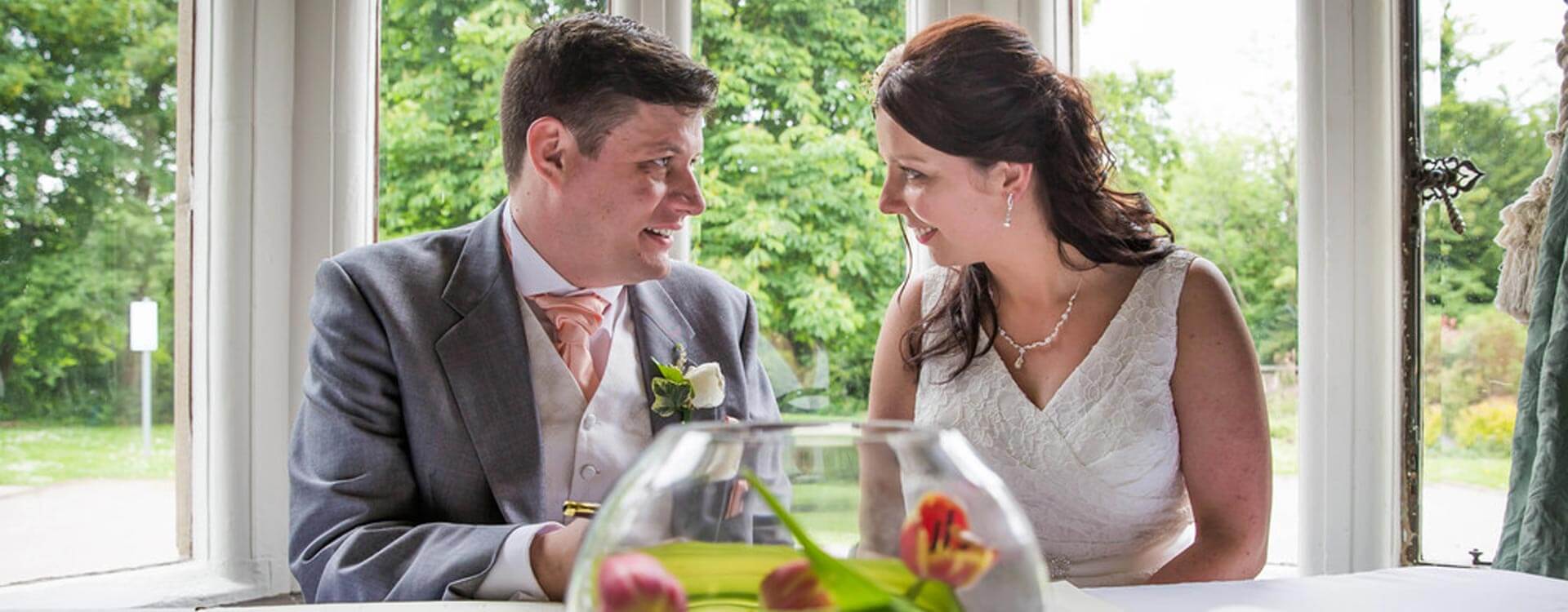 Bride and groom signing the marriage register